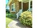 Inviting front porch with white lattice and steps leading to a cozy entrance, perfect for enjoying the outdoors at 323 Ranch Farm Rd, Raleigh, NC 27603