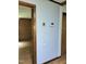 Hallway with wood flooring, adjacent to a living space with wooden panelling at 323 Ranch Farm Rd, Raleigh, NC 27603
