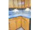 A kitchen with light wood cabinets and a gray countertop at 323 Ranch Farm Rd, Raleigh, NC 27603