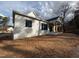 Exterior side of house with wooden porch columns and large windows at 3321 Founding Place, Raleigh, NC 27612