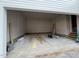 Unfinished two-car garage interior with concrete floor and drywall walls at 3321 Founding Place, Raleigh, NC 27612