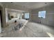 Unfinished living room showcasing open floor plan and large window openings at 3321 Founding Place, Raleigh, NC 27612
