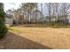 The backyard has a large lawn at 3528 Dewing Dr, Raleigh, NC 27616