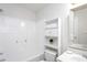 Clean bathroom featuring a shower-tub, toilet, and storage cabinet at 3528 Dewing Dr, Raleigh, NC 27616