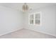 Well-lit bedroom featuring a neutral palette, carpet, and a stylish light fixture at 3528 Dewing Dr, Raleigh, NC 27616