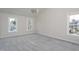 Bright bedroom with neutral carpet, multiple windows, and natural light at 3528 Dewing Dr, Raleigh, NC 27616