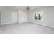 Spacious bedroom featuring carpet, neutral paint, closets and a modern light fixture at 3528 Dewing Dr, Raleigh, NC 27616