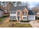 Attractive home with a combination of brick and siding, well-manicured landscaping, and a two-car garage at 3528 Dewing Dr, Raleigh, NC 27616