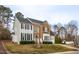 Lovely two-story home boasts a blend of classic architecture and verdant surroundings at 3528 Dewing Dr, Raleigh, NC 27616