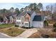 Beautiful two-story home with brick and siding exterior, attached garage, and manicured front lawn at 3528 Dewing Dr, Raleigh, NC 27616