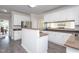Spacious kitchen featuring ample cabinet space, stainless steel appliances, and hardwood floors at 3528 Dewing Dr, Raleigh, NC 27616