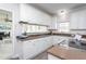 Well-lit kitchen showcasing white cabinetry, wood countertops, and modern appliances at 3528 Dewing Dr, Raleigh, NC 27616