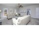 Living room area with ceiling fan, neutral paint, two sofas and an entrance to the kitchen at 3528 Dewing Dr, Raleigh, NC 27616