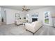 Neutral living room features a fireplace, two white sofas, and large windows for natural light at 3528 Dewing Dr, Raleigh, NC 27616