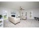 Bright living room with plush carpeting, fireplace, and ample seating at 3528 Dewing Dr, Raleigh, NC 27616