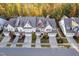 Beautiful aerial view of townhomes showcasing manicured landscaping, driveways, and autumn foliage at 357 Roberts Ridge Dr, Cary, NC 27513