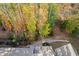 Aerial image showcasing home's backyard surrounded by colorful fall foliage at 357 Roberts Ridge Dr, Cary, NC 27513