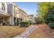 Exterior shot showcasing backyard path with stone accents and well-maintained landscaping at 357 Roberts Ridge Dr, Cary, NC 27513