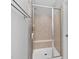 Tiled shower features a built-in bench and glass door, designed for comfort and convenience at 357 Roberts Ridge Dr, Cary, NC 27513