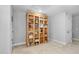 Bedroom with built-in shelving unit, neutral walls, and light carpet at 357 Roberts Ridge Dr, Cary, NC 27513