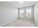 Well-lit bedroom with large windows offering neighborhood views at 357 Roberts Ridge Dr, Cary, NC 27513