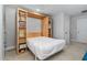 Bedroom featuring a murphy bed with a built-in bookcase and shelves at 357 Roberts Ridge Dr, Cary, NC 27513