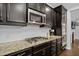 Close-up of modern kitchen with granite counters, gas cooktop, subway tile backsplash, and stainless steel appliances at 357 Roberts Ridge Dr, Cary, NC 27513