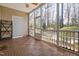 Relaxing screened-in porch with wood-look flooring, and ceiling fan at 357 Roberts Ridge Dr, Cary, NC 27513