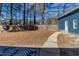 Expansive backyard with a sturdy wooden fence, providing privacy and security, bordering a lush treeline at 388 Holland Dr, Smithfield, NC 27577