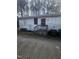 Back view of a single story home with a small deck and door at 4805 Barbee Rd, Durham, NC 27713