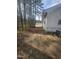 A very narrow backyard sits next to the home with a small path at 4805 Barbee Rd, Durham, NC 27713