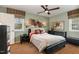 Cozy bedroom with a ceiling fan, a window with natural light, and a full-sized bed at 4812 Stonehill Dr, Raleigh, NC 27609
