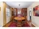 Formal dining room boasts an elegant chandelier and lovely built-in cabinets at 4812 Stonehill Dr, Raleigh, NC 27609