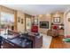Comfortable living room with a fireplace, hardwood floors, and stylish decor, perfect for relaxation at 4812 Stonehill Dr, Raleigh, NC 27609