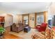 Bright and airy living room with hardwood floors, comfortable seating, and ample natural light at 4812 Stonehill Dr, Raleigh, NC 27609