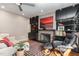 Comfortable living room has a fireplace, sleek built-in shelves, and modern decor at 4812 Stonehill Dr, Raleigh, NC 27609