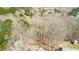 An aerial view showcases a residential area with mature trees and glimpses of nearby homes at 4901 North Pointe, Sanford, NC 27332