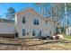 Backyard of home, featuring a stone patio and exterior of house in the background at 4901 North Pointe, Sanford, NC 27332