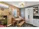 The rustic dining room boasts a decorative brick wall with a wooden bench and bench seating at 4901 North Pointe, Sanford, NC 27332