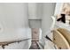 Bright stairwell with carpeted stairs, wooden railing, and a chair lift installed at 4901 North Pointe, Sanford, NC 27332