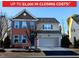 Charming two-story home featuring brick facade, blue shutters, and an attached two-car garage at 508 Stapleford Ln, Fuquay Varina, NC 27526