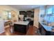 Charming kitchen featuring stainless steel appliances, dark cabinetry and granite countertops at 508 Stapleford Ln, Fuquay Varina, NC 27526