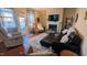 Comfortable living area featuring a fireplace, hardwood floors, and ample seating at 508 Stapleford Ln, Fuquay Varina, NC 27526
