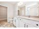 Elegant bathroom featuring double vanity, tile floors, and a spacious walk-in closet at 5389 Salem Woods Dr # 12, Graham, NC 27253
