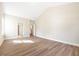 Spacious bedroom boasts wood-look floors, ensuite access, and vaulted ceiling detail at 5389 Salem Woods Dr # 12, Graham, NC 27253