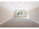 Bedroom with neutral carpet, large window and bright natural light at 5389 Salem Woods Dr # 12, Graham, NC 27253
