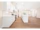Modern kitchen featuring white cabinets, stainless steel appliances, and an island with seating at 5389 Salem Woods Dr # 12, Graham, NC 27253