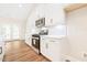 Well-equipped kitchen featuring white cabinets, stainless steel appliances, and plenty of counter space at 5389 Salem Woods Dr # 12, Graham, NC 27253