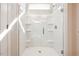 Large glass shower enclosure with built-in shelving and modern fixtures at 5389 Salem Woods Dr # 12, Graham, NC 27253