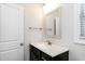 Bathroom vanity featuring marble countertop, dark wood cabinets, and brushed nickel hardware at 5439 Cokesbury Rd, Fuquay Varina, NC 27526